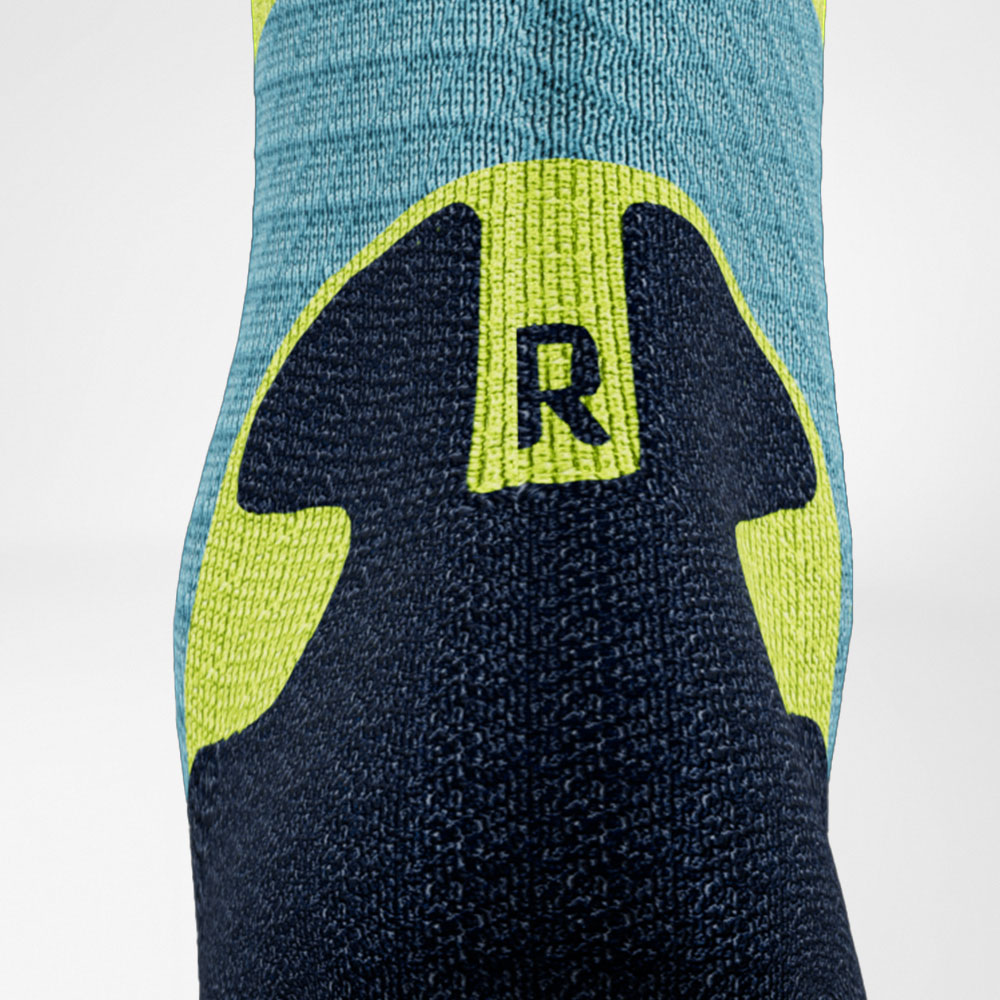Trailrun-Laufsocken blau-gelb Detail Comfort Zone Detailansicht des Achillessehenbereiches der blau-gelben Trailrun - Laufsocken